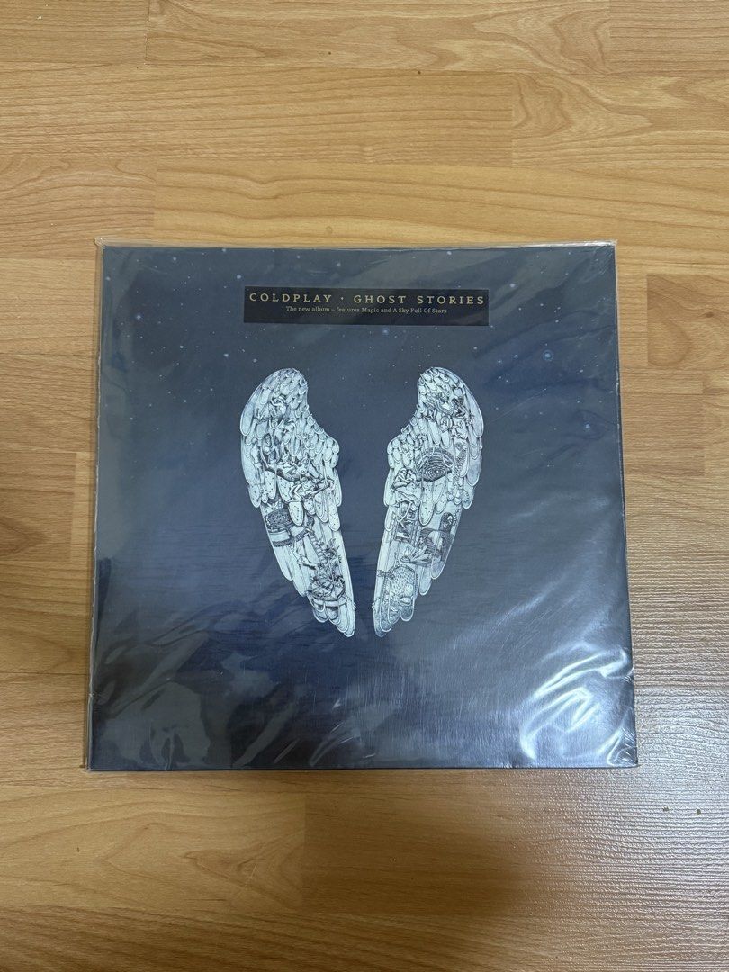 Coldplay Ghost Stories Vinyl Record LP Sealed (Category: Vinyls) located in Manila. Submitted by rkpd1 (Listing ID 1422812905, Image 1). Description: - Coldplay "Ghost Stories" vinyl record - Still sealed in original packaging - Features popular tracks: "Magic", "A Sky Full of Stars", and more - Includes tracklist on the back cover (Side A & B) - Tracklist: Side A: Always in my head Magic Ink True Love Midnight Side B: Another’s Arms Oceans A Sky