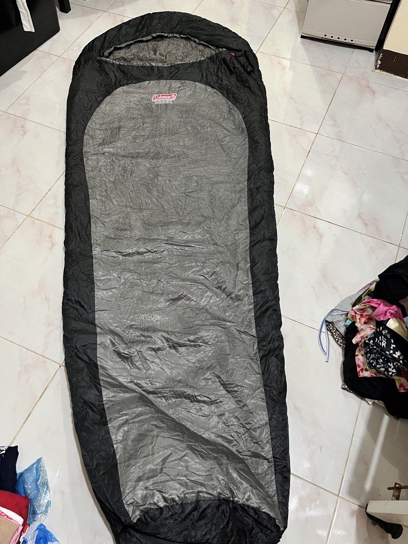 Coleman MAX Sleeping Bag (Category: Hiking & Camping) located in Batangas. Submitted by seiferdg (Listing ID 1422814502, Image 1). Description: - Coleman MAX sleeping bag - Black and gray color scheme - Features a zipper closure - Includes care instructions tag - Ideal for camping and outdoor activities.