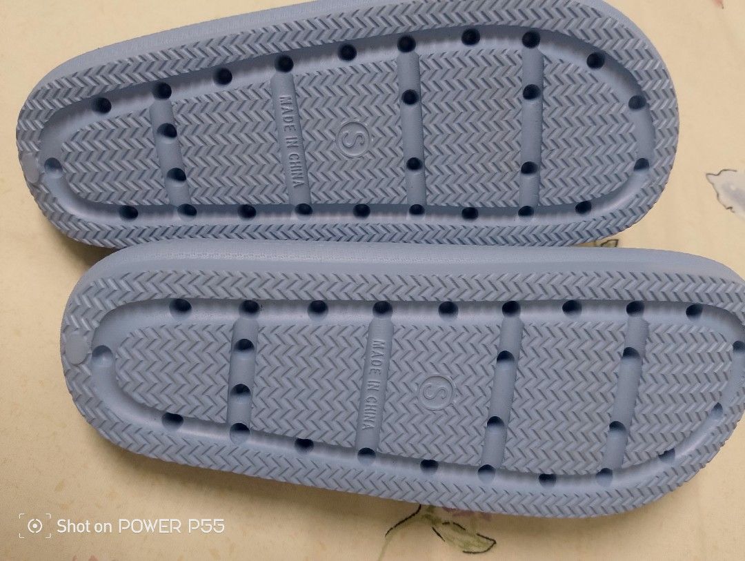 Cool Slides - Blue (Category: Slippers and slides) located in Binan City. Submitted by stuffshop29 (Listing ID 1422823140, Image 2). Description: Light blue slides. Features a textured footbed and sole for grip. The sole has a size marking of 'S'. Made in China. The slides have a simple, open-toe design. The brand name 'Cool' is visible on the footbed..