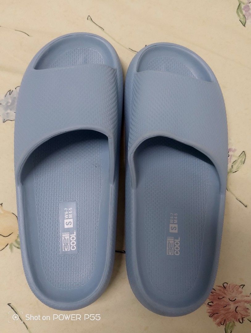 Cool Slides - Blue (Category: Slippers and slides) located in Binan City. Submitted by stuffshop29 (Listing ID 1422823140, Image 1). Description: Light blue slides. Features a textured footbed and sole for grip. The sole has a size marking of 'S'. Made in China. The slides have a simple, open-toe design. The brand name 'Cool' is visible on the footbed..