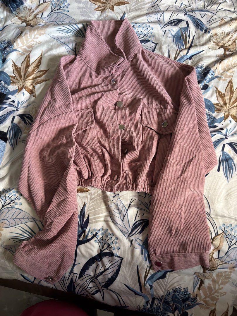 Corduroy Cropped Jacket (Category: Coats, Jackets and Outerwear) located in Mandaluyong City. Submitted by thv_bwee (Listing ID 1422800247, Image 2). Description: - Corduroy cropped jacket - High collar - Button-down closure - Two front pockets - Long sleeves with buttoned cuffs - Gathered waist - Available colors: Brown, Pink - Adds vintage flair Both from tiktok Brown: 250 Pink: 150 with minimal damage 350 if getting both.
