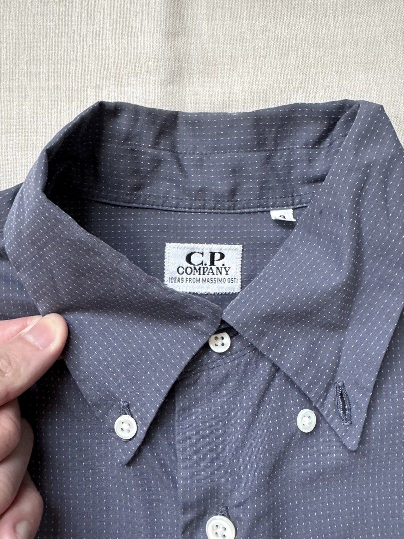 CP Company Shirt (Category: Shirts) located in Singapore. Submitted by mangosteeeeen (Listing ID 1422830540, Image 2). Description: C.P. COMPANY DOT NAVY SHIRT DESIGNED BY MASSIMO OSTI, FOUNDER OF STONE ISLAND BEAUTIFUL STICHING WORK AROUND THE SHIRT SIZE 3 FITS A LARGE .