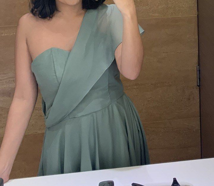 (Custom gown) Sage Green One-Shoulder (Category: Dresses) located in Taguig. Submitted by new_again_ (Listing ID 1422769771, Image 3). Description: - Elegant sage green maxi dress - One-shoulder design with asymmetrical overlay - Fitted bodice - Flowing skirt with high-low hemline - Includes delicate spaghetti strap - Made of lightweight, flowing fabric - Ideal for special occasions.