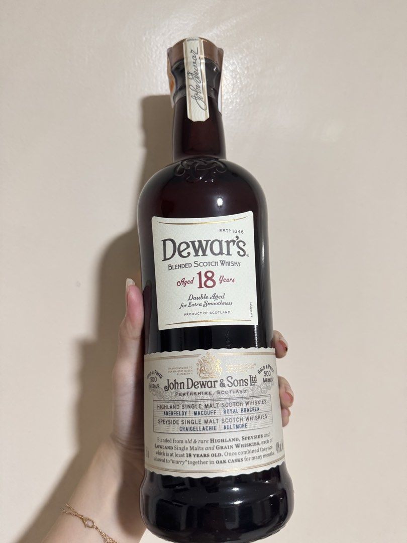 Dewar's 18 Year Old Blended Scotch Whisky (Category: Beverages) located in Manila. Submitted by shermaineg (Listing ID 1422760272, Image 3). Description: - Dewar's 18 Year Old Blended Scotch Whisky - 750ml bottle - Double aged for extra smoothness - Made in Scotland - Includes original box - Box features a copper-like finish - Bottle is sealed.
