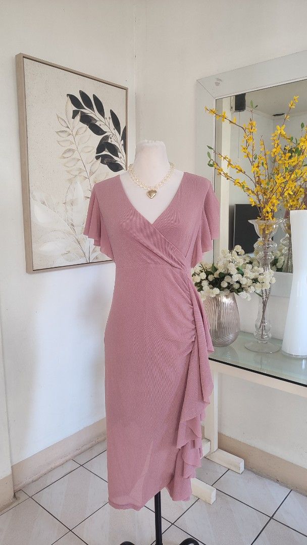 Dusty Shimmer Midi Dress (Category: Dresses) located in Navotas City. Submitted by ivyyy21 (Listing ID 1422824940, Image 2). Description: This item is a dusty rose knitted wrap dress featuring v-neckline, bell sleeves, and a draped ruffled hem. .