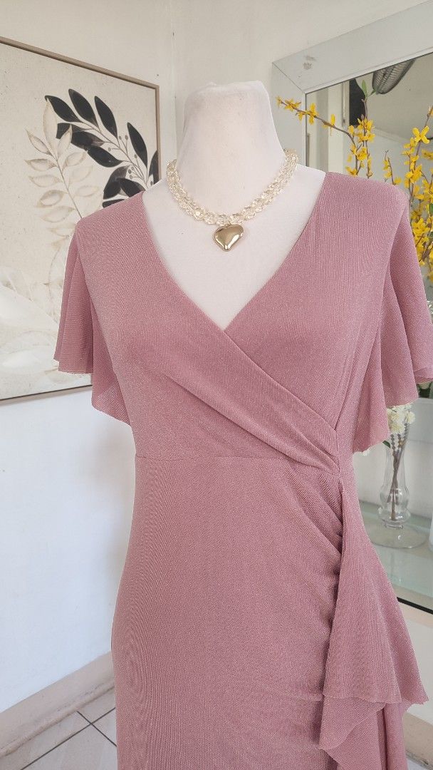Dusty Shimmer Midi Dress (Category: Dresses) located in Navotas City. Submitted by ivyyy21 (Listing ID 1422824940, Image 3). Description: This item is a dusty rose knitted wrap dress featuring v-neckline, bell sleeves, and a draped ruffled hem. .