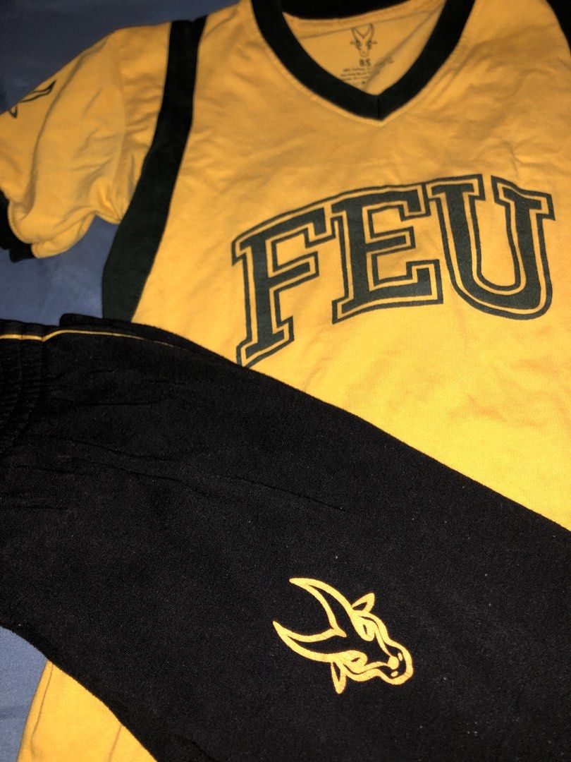 FEU Shirt and Pants Set (WRP Uniform) (Category: Sets or Coordinates) located in Manila. Submitted by gandariamarie (Listing ID 1422784509, Image 1). Description: - FEU shirt with green accents - Features FEU logo on front and sleeve - Includes black pants with elastic waistband - Pants have logo on the side - Ideal for casual wear or showing school spirit.