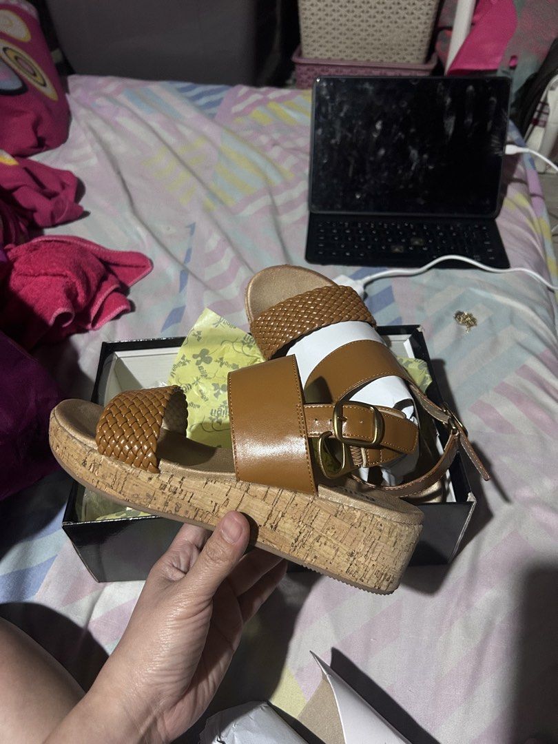 Figlia Pierce Tan Sandals Size 36 (Category: Flats & Sandals) located in Manila. Submitted by emsmerize (Listing ID 1422851356, Image 1). Description: - Figlia Pierce sandals - Tan color - Size 36 - Woven strap design - Cork wedge heel - Includes original box - Selling Price: 500PHP (Original Price: 1499 PHP) Used once same as new.