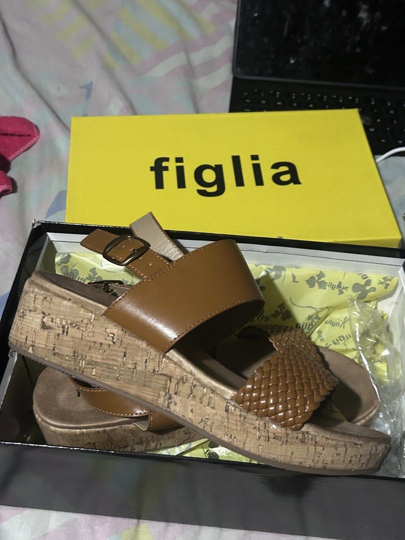 Figlia Pierce Tan Sandals Size 36 (Category: Flats & Sandals) located in Manila. Submitted by emsmerize (Listing ID 1422851356, Image 3). Description: - Figlia Pierce sandals - Tan color - Size 36 - Woven strap design - Cork wedge heel - Includes original box - Selling Price: 500PHP (Original Price: 1499 PHP) Used once same as new.