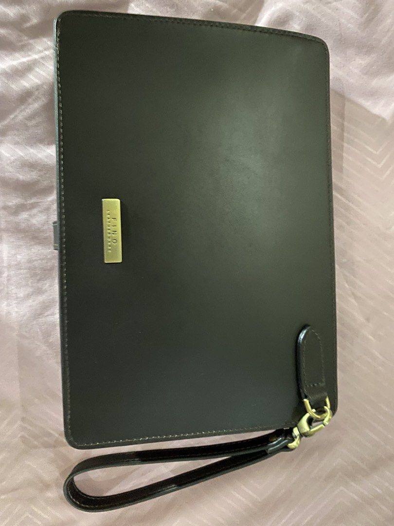 Fino Clutch Bag (Category: Luxury Bags & Wallets) located in Manila. Submitted by lauro.catibayan (Listing ID 1422821382, Image 1). Description: Fino black leather clutch bag. 10 inches width, 7 inches height. Like new .