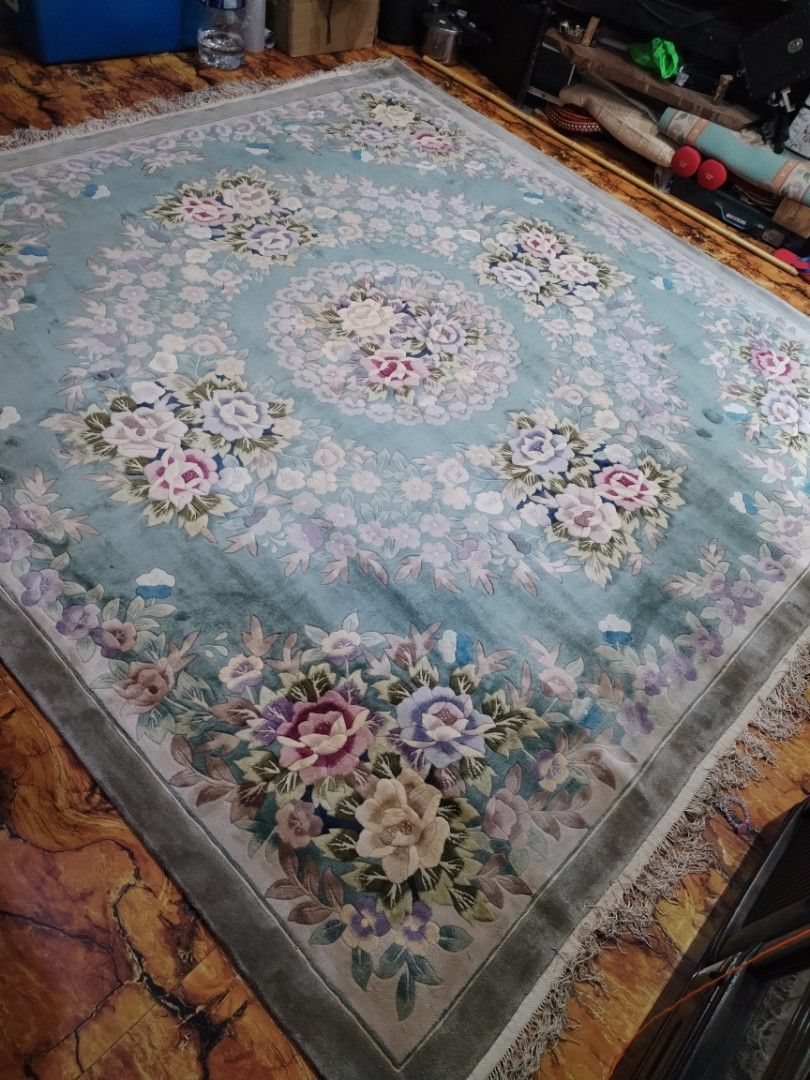 Floral Pattern Area Rug (Category: Carpets, Mats & Flooring) located in Caloocan City. Submitted by rowely_jpn (Listing ID 1422747732, Image 2). Description: Beautiful area rug with a floral pattern. The rug has a light blue background with a central floral medallion and floral borders. It has a fringe on the edges. The dimensions are 98.5 x 96.5 inches. It is suitable for living rooms or bedrooms..