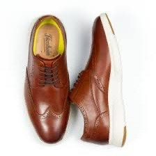 Florsheim Dash Wingtip Oxford Sneakers (Category: Dress Shoes) located in Makati City. Submitted by harekrisha (Listing ID 1422883895, Image 1). Description: These are my husband’s Florsheim Dash Wingtip Oxford sneakers in brown, combining a traditional brogued leather upper with a lightweight athletic sole for a polished yet comfortable look. Purchased from Amazon and originally paid 8,600 plus shipping..