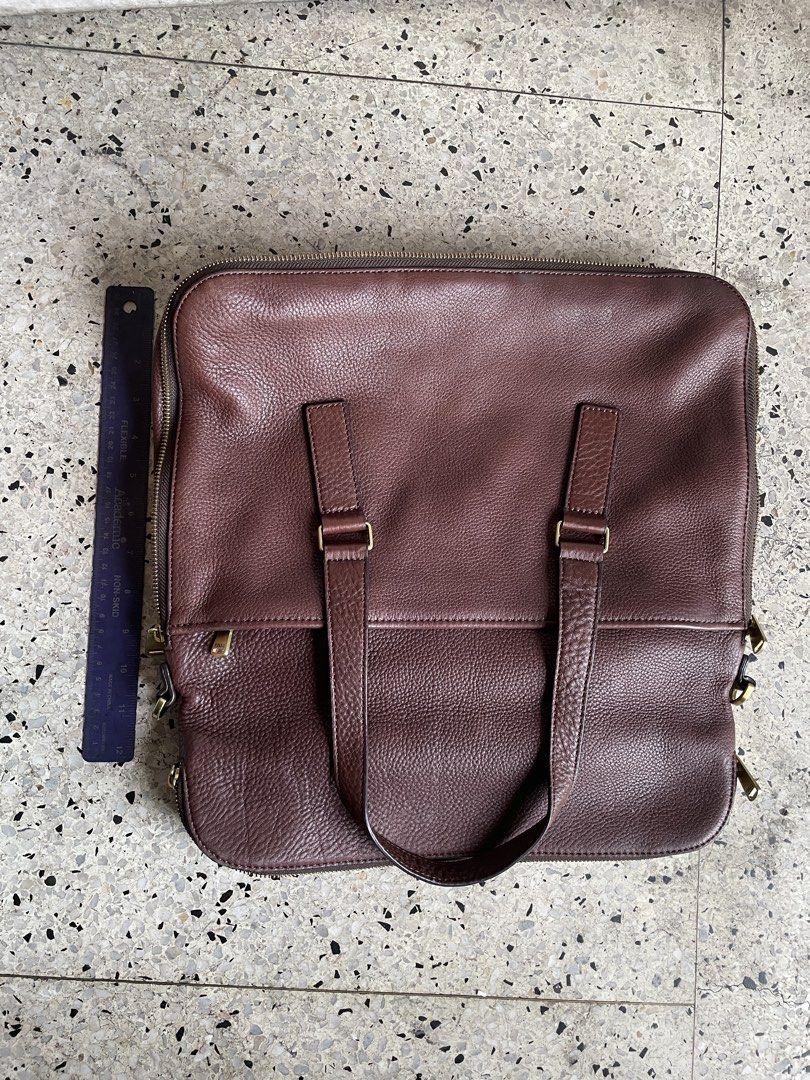 Fossil brown leather satchel (Category: Luxury Bags & Wallets) located in Quezon City. Submitted by liama (Listing ID 1422727736, Image 3). Description: Classic brown soft leather Tote for laptop, books, papers Zipper, also has expandable zipper Brass detail <BDO/Metrobank; buyer books/pays for pickup>.