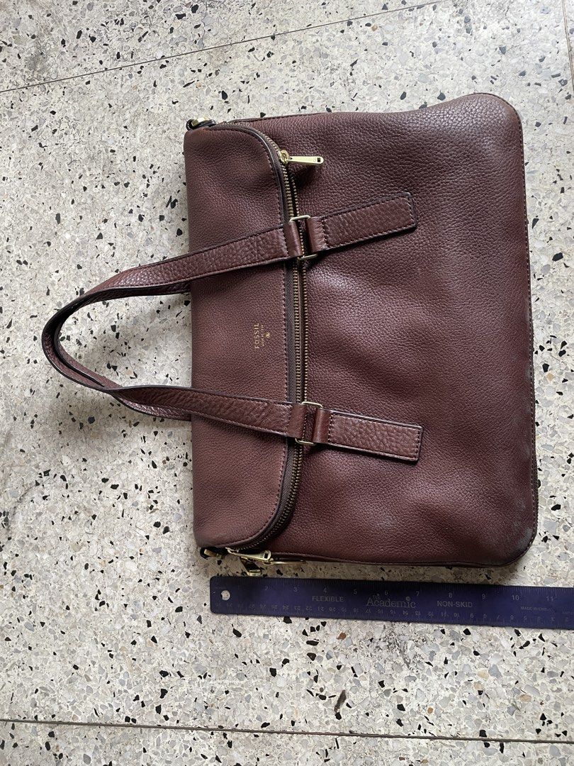 Fossil brown leather satchel (Category: Luxury Bags & Wallets) located in Quezon City. Submitted by liama (Listing ID 1422727736, Image 1). Description: Classic brown soft leather Tote for laptop, books, papers Zipper, also has expandable zipper Brass detail <BDO/Metrobank; buyer books/pays for pickup>.