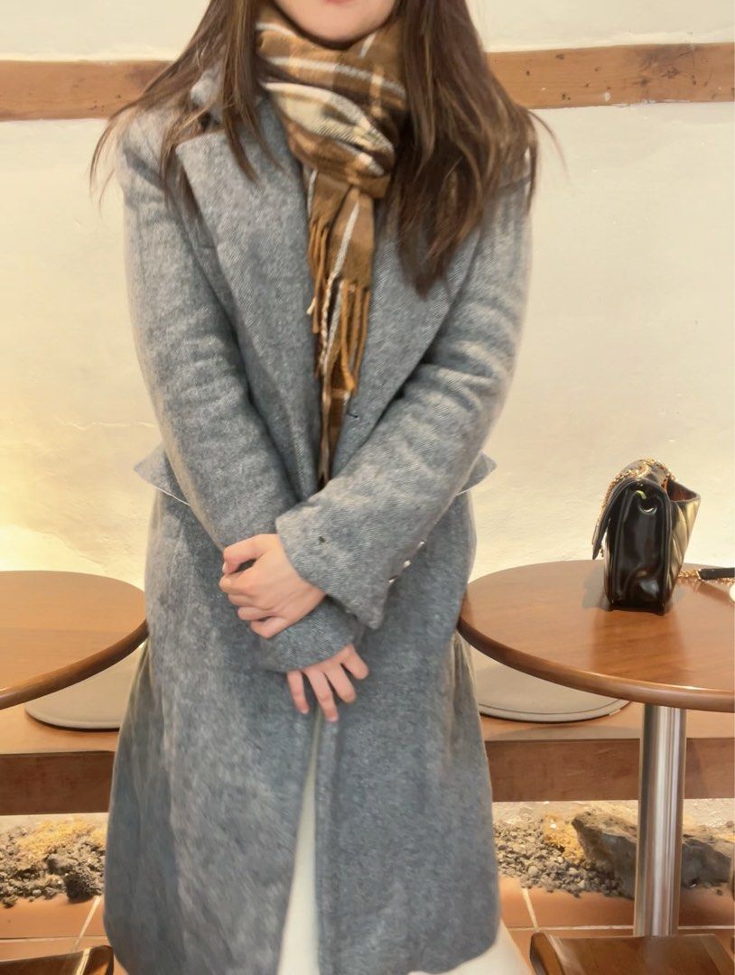 Gray Long Coat (Category: Coats, Jackets and Outerwear) located in Makati City. Submitted by warm.abc123 (Listing ID 1422767427, Image 3). Description: Long coat wool blend tweed - Classic gray coat - Button closure - Tailored fit - Soft fabric (possibly wool-blend) - Lapel collar - Long sleeves - Suitable for cooler weather - Versatile for various outfits.