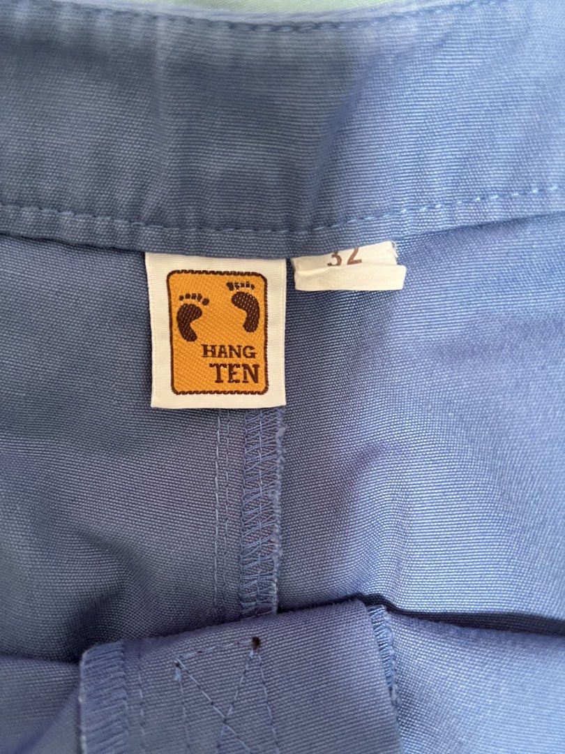 Hang Ten Blue Shorts with Stripes (Category: Swim Trunks & Board Shorts) located in Dasmarinas. Submitted by kelcastillo (Listing ID 1422750204, Image 3). Description: - Hang Ten shorts - Size 32 - Blue with orange and yellow side stripes - Back pocket - Drawstring closure - Small Hang Ten logo - Durable material.