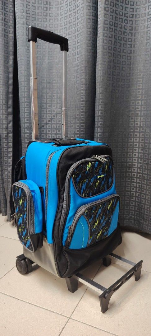 Hawk Trolly Bag (Category: Backpacks) located in Santa Rosa. Submitted by charminesa81895 (Listing ID 1422822869, Image 2). Description: - Rolling backpack in blue and black with a unique front pattern. - Multiple compartments and side pockets for storage. - Extendable handle for easy rolling. - Durable wheels. - Spacious interior for school or travel. - Includes a name tag slot..
