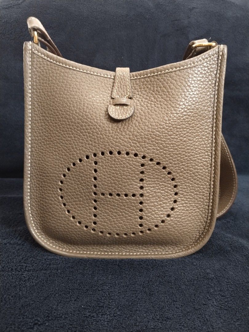 Hermes evelyn TPM Bag (Category: Luxury Bags & Wallets) located in Bayombong. Submitted by rnstrifty (Listing ID 1422856455, Image 1). Description: - not sure on authenticity - Neutral color - Iconic 'H' perforation detail - Flap closure with button - Interior visible in photos - Made in France.