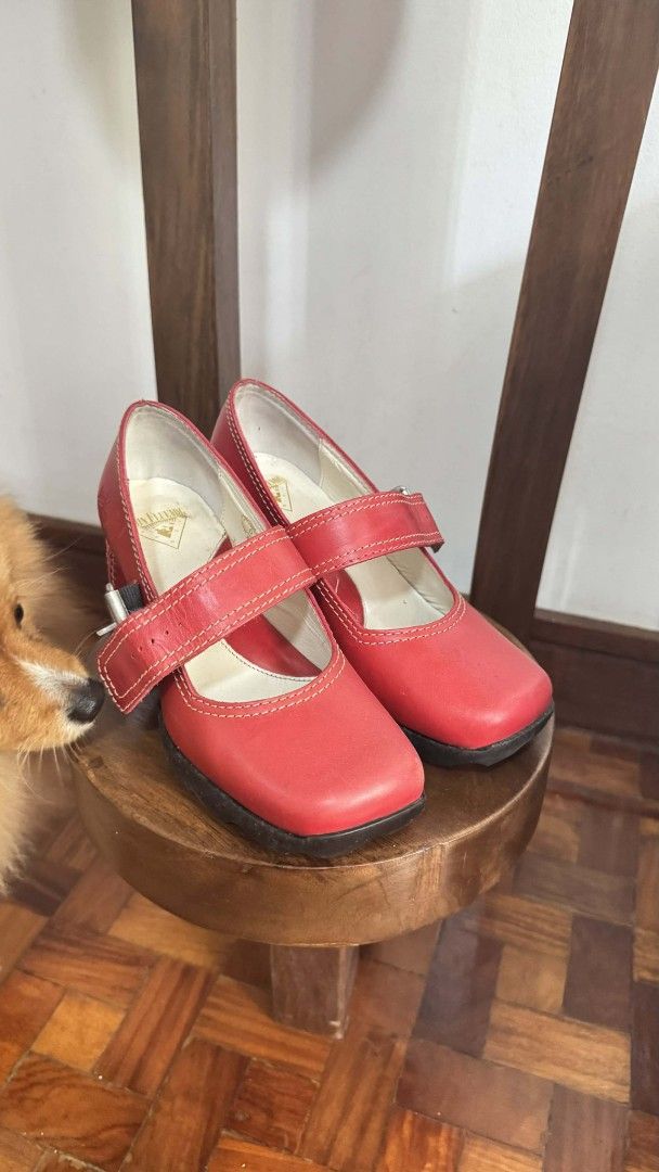John Fluevog - Mary Jane Shoes Last of its Kind (Category: Flats & Sandals) located in Mandaluyong City. Submitted by sweetangel.21 (Listing ID 1422774717, Image 1). Description: - Together Hi Benatar -Discontinued Design at Size 6 -Red Mary Jane shoes - Square toe design - Strap closure - Small heel - Leather material - Gold logo inside.