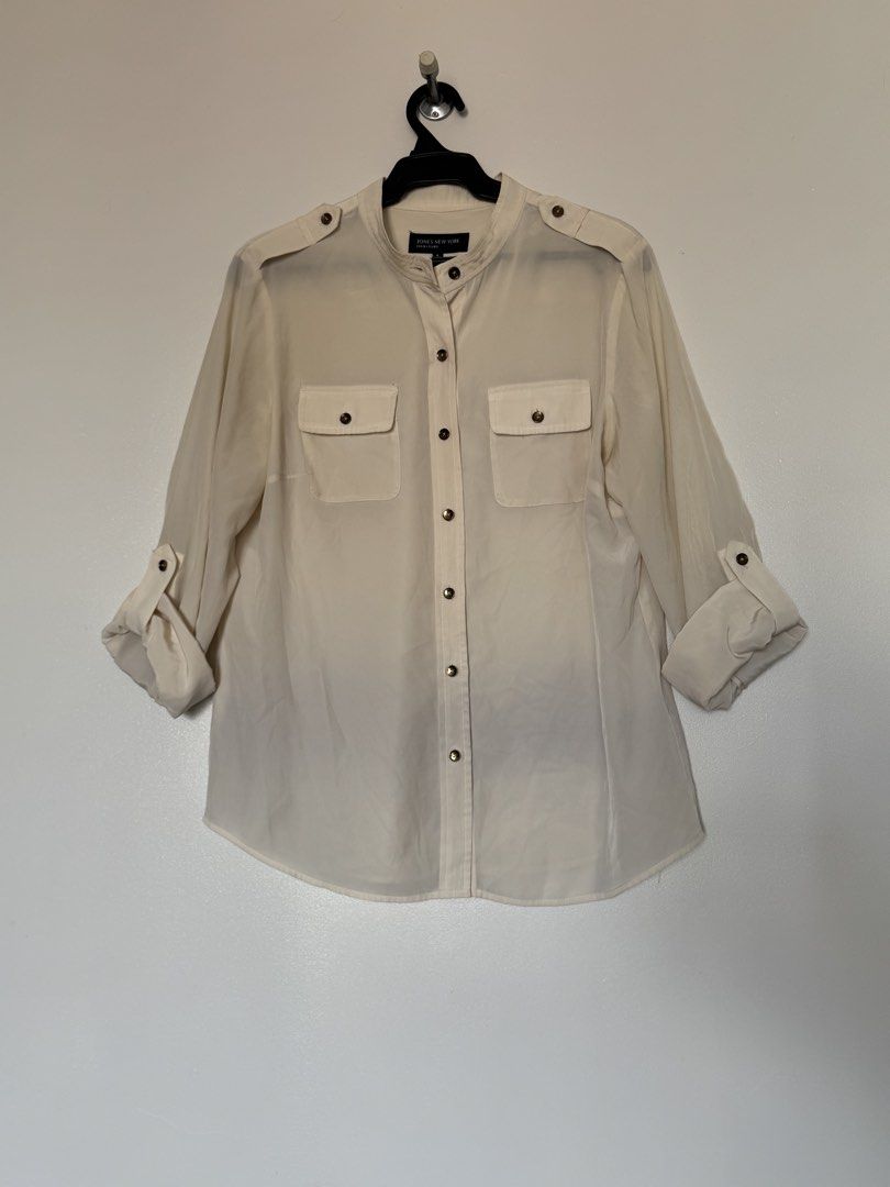 Jones New York cream polo (Category: Longsleeves) located in Makati City. Submitted by pattystuff (Listing ID 1422776330, Image 1). Description: - Cream longsleeves with Henley collar and sleeve tabs - Silky material - Needs washing - Pre-loved, please manage expectations.
