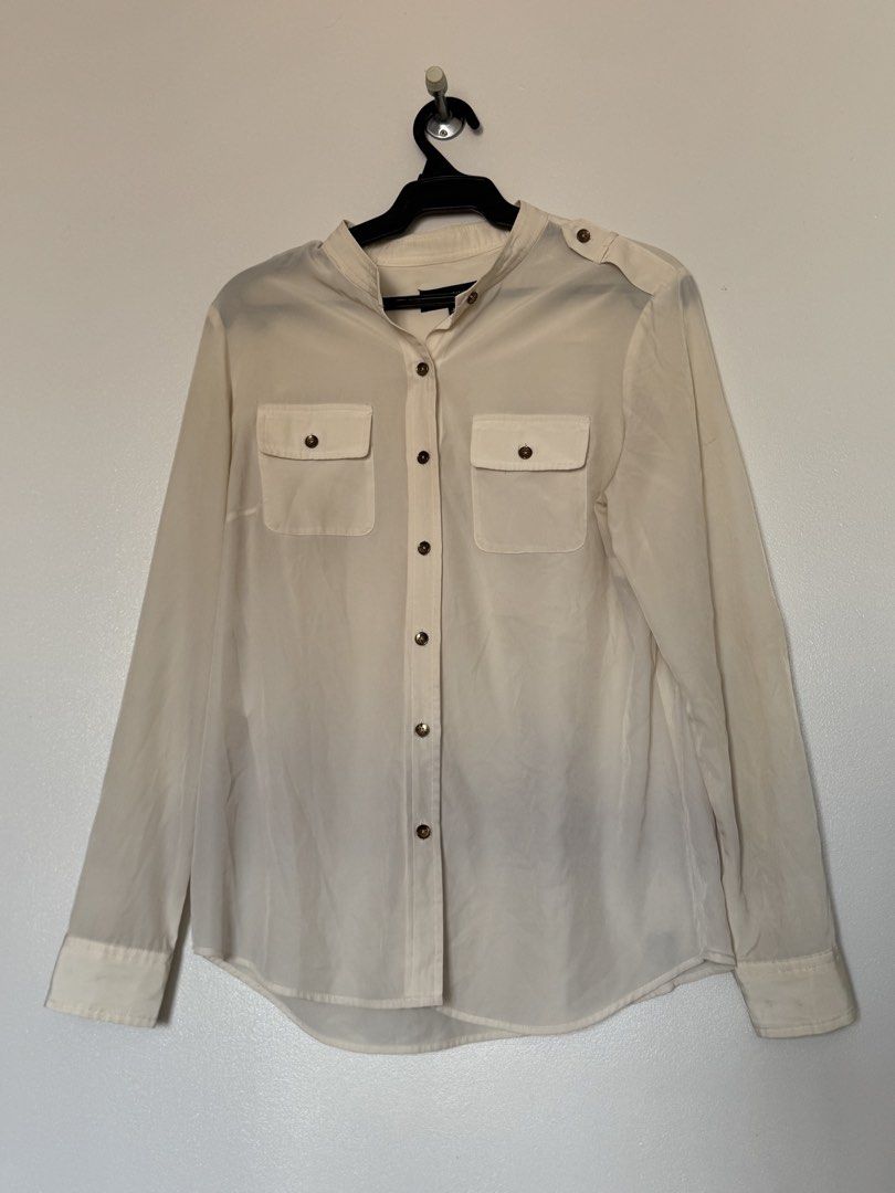 Jones New York cream polo (Category: Longsleeves) located in Makati City. Submitted by pattystuff (Listing ID 1422776330, Image 3). Description: - Cream longsleeves with Henley collar and sleeve tabs - Silky material - Needs washing - Pre-loved, please manage expectations.