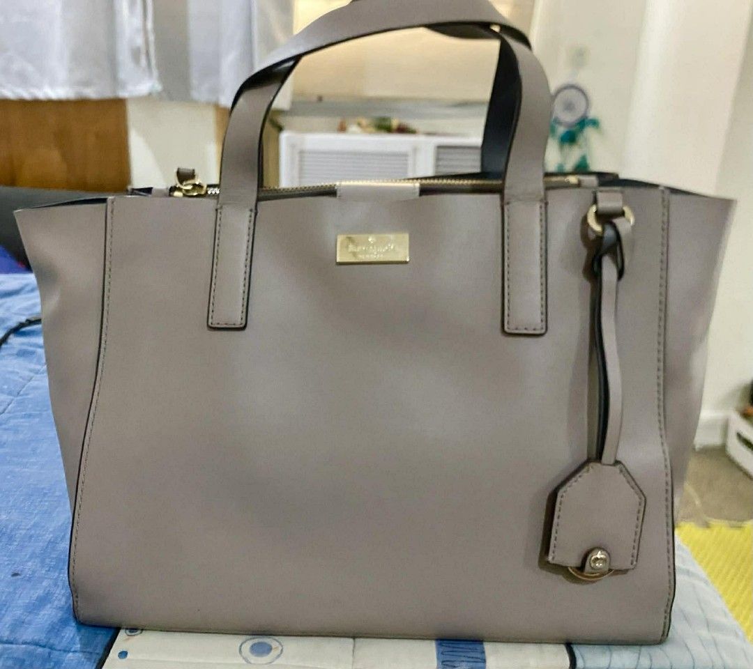 Kate Spade Cameron Street Medium Satchel (Category: Shoulder Bags) located in Paranaque City. Submitted by gavinledesma (Listing ID 1422882596, Image 2). Description: Kate Spade Cameron Street Medium Satchel -100% Genuine cow leather, structured saffiano leather with gold hardware -Taupe/greige neutral color -Dual top handles + long detachable shoulder strap -With shopping carton bag and green booklet -Very good pre-loved condition, clean, sturdy