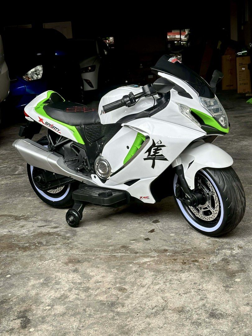 Kids Electric Motorcycle (Category: Motorbikes for Sale) located in Quezon City. Submitted by audreyymiles (Listing ID 1422730106, Image 2). Description: Selling my son’s electric motorcycle 🏍️ Suzuki Hayabusa–inspired Used less than 10 times, hanggang parking area lang 😅 RFS: Need more space, so we decided to sell it. Suitable For: Kids aged 2 to 12 years old Weight capacity: Up to 65-75 kg Battery is rechargeable and easy to use. 📍 Project 4