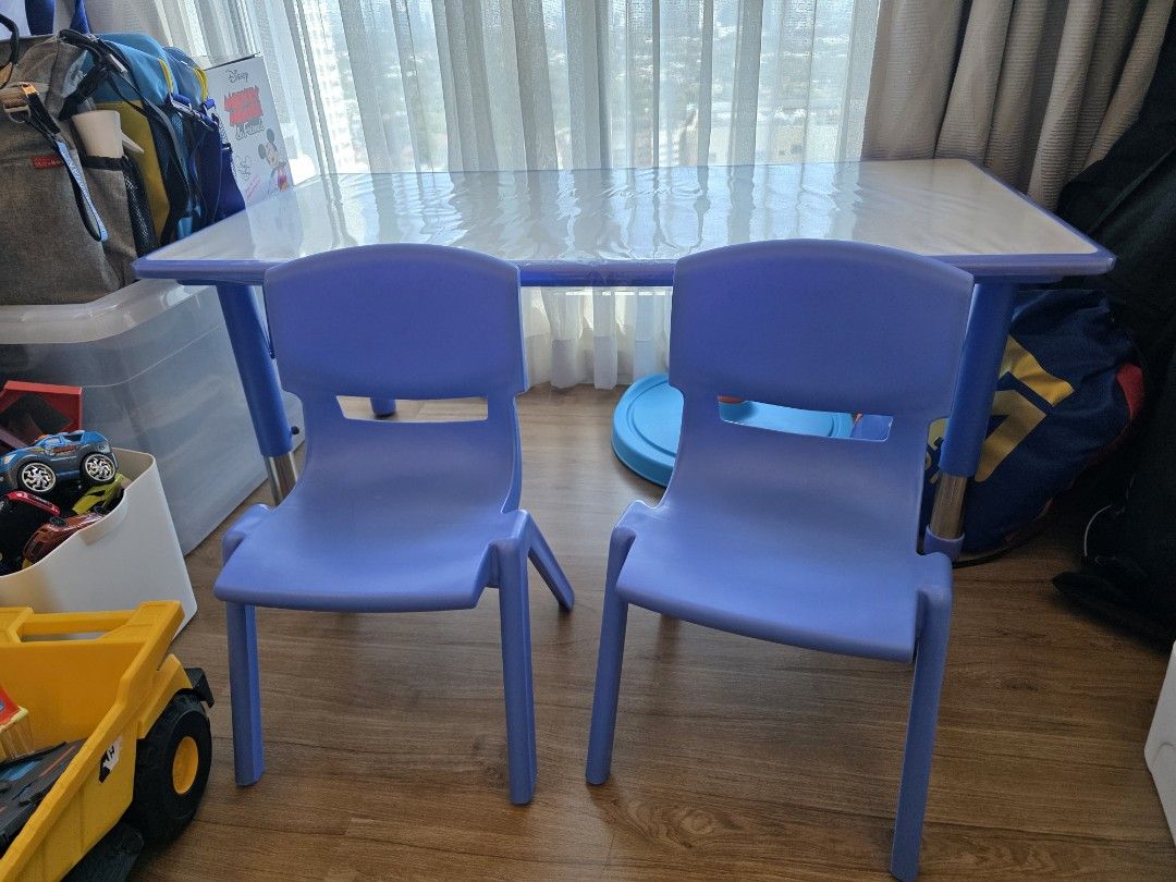 Kids Table and Chairs Set (Category: Kids Tables & Chairs) located in Pasig City. Submitted by pepperoo (Listing ID 1422720560, Image 1). Description: - Includes a rectangular table and two blue chairs. - Table features adjustable legs and a clear plastic cover. - Chairs are made of durable blue plastic. - Ideal for kids' activities, snacks, and playtime. - Sturdy and easy to clean. Bought from Raptor QC RFS: Decluttering SRP: Table - 4400, Chair