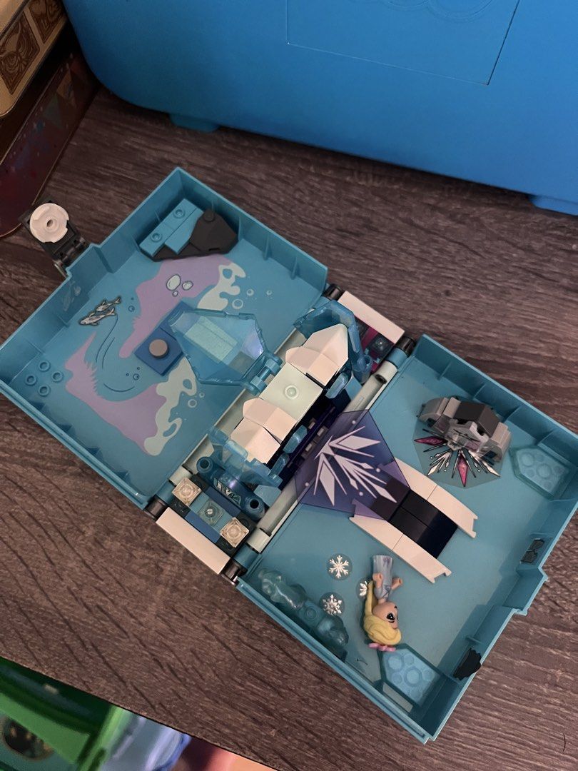 Lego Disney Frozen Book (Category: Lego & Building Sets) located in Cebu City. Submitted by abct1 (Listing ID 1422785362, Image 3). Description: - Disney Frozen Lego set - Book-shaped design - Detailed interior scene - Includes Lego figures and accessories - Features a Frozen-themed emblem - Lego logo visible.