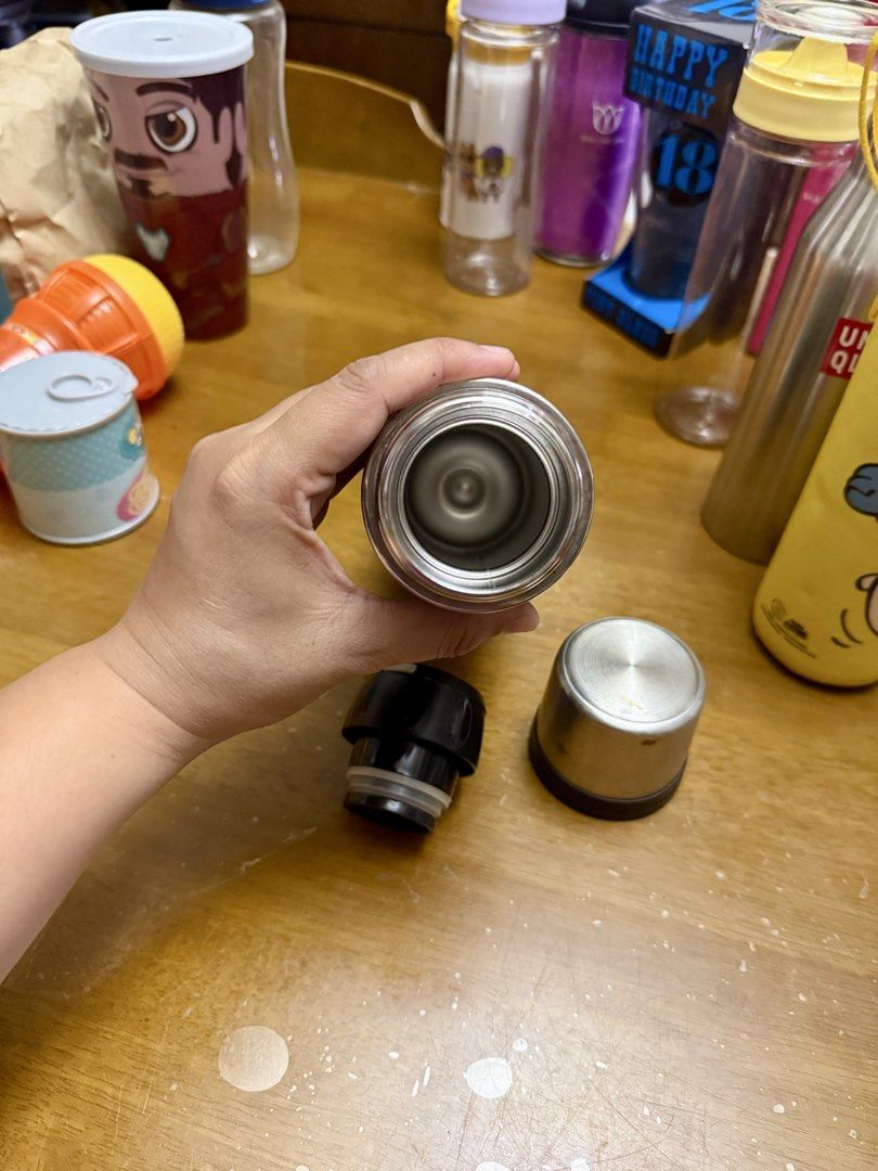 Living Art Thermos (Category: Coffee & Tea Tableware) located in Pilar. Submitted by faveanyshop (Listing ID 1422788116, Image 3). Description: - Living Art thermos - Black body with silver top and bottom - Push-button lid - Clean interior - Korean text on the bottom - Keeps drinks hot or cold.