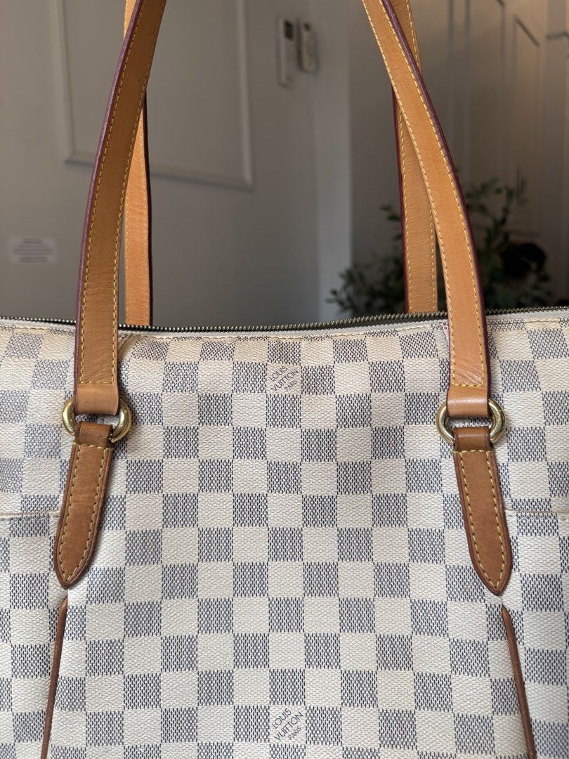 Louis Vuitton Damier Azur Tote Bag (Category: Luxury Bags & Wallets) located in Manila. Submitted by moiluxe (Listing ID 1422871855, Image 2). Description: - Damier Azur tote bag - Features the iconic Damier Azur checkered pattern - Includes two side pockets - Spacious interior with multiple compartments - Durable leather handles and trim - Secure zipper closure - Made in France.