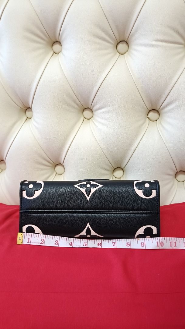 Louis Vuitton OnTheGo PM Black Pink (Category: Luxury Bags & Wallets) located in Cebu City. Submitted by erlacoleccion (Listing ID 1422760830, Image 2). Description: - Louis Vuitton OnTheGo PM handbag -Japan Surplus - Black exterior with pink monogram print - Two top handles - Detachable shoulder strap - Red interior lining - Gold-tone hardware - Stylish and versatile design.