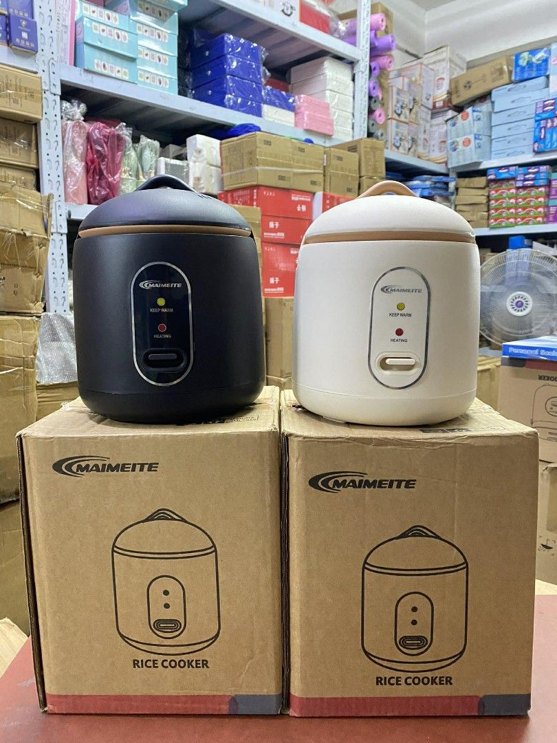 MAIMEITE 1.2L Mini Rice Cooker (Category: Cookers) located in Manila. Submitted by yzlshop (Listing ID 1422734546, Image 1). Description: MAIMEITE mini rice cooker has a 1.2L capacity and can cook rice in 900 seconds. It features a thickened liner and a 24-hour automatic warm keeping function. The safety cover has an inner buckle and an anti-scalding design. It comes with a measuring cup, spoon, and steamer. Available in black and white..