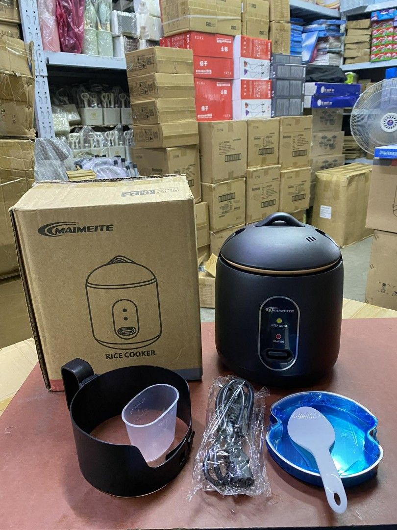 MAIMEITE 1.2L Mini Rice Cooker (Category: Cookers) located in Manila. Submitted by yzlshop (Listing ID 1422734546, Image 2). Description: MAIMEITE mini rice cooker has a 1.2L capacity and can cook rice in 900 seconds. It features a thickened liner and a 24-hour automatic warm keeping function. The safety cover has an inner buckle and an anti-scalding design. It comes with a measuring cup, spoon, and steamer. Available in black and white..