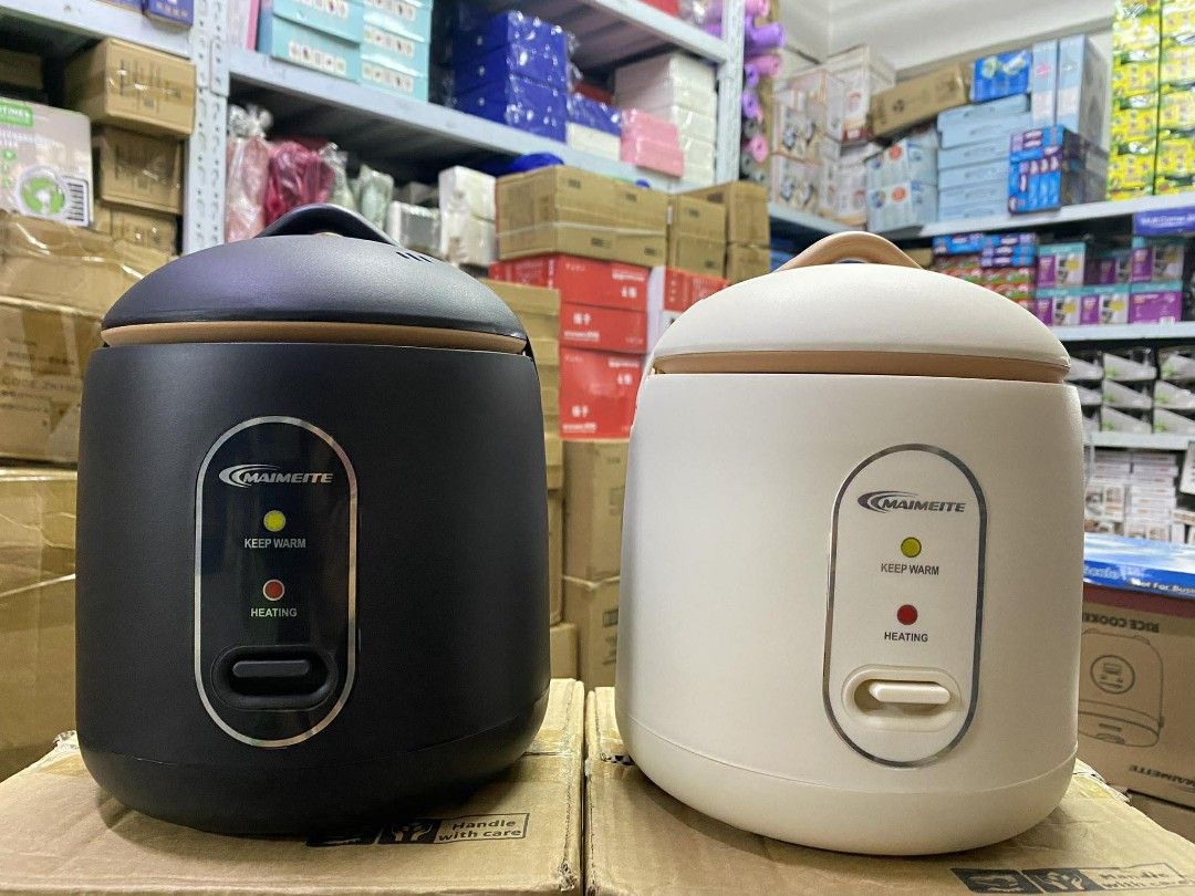 MAIMEITE 1.2L Mini Rice Cooker (Category: Cookers) located in Manila. Submitted by yzlshop (Listing ID 1422734546, Image 3). Description: MAIMEITE mini rice cooker has a 1.2L capacity and can cook rice in 900 seconds. It features a thickened liner and a 24-hour automatic warm keeping function. The safety cover has an inner buckle and an anti-scalding design. It comes with a measuring cup, spoon, and steamer. Available in black and white..