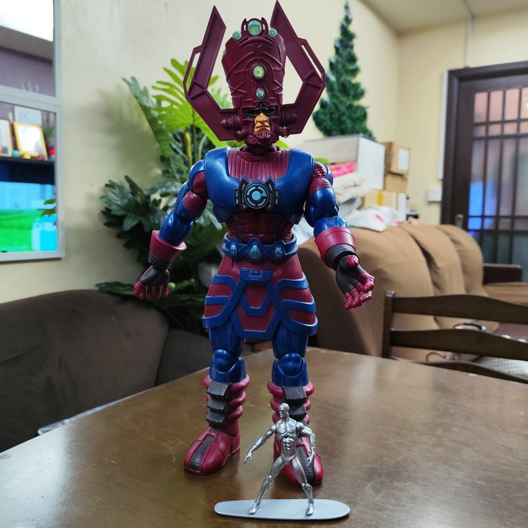 Marvel Legends Galactus Action Figure 20 inch (Category: Figurines & Statues) located in Manila. Submitted by lunaticlo01485 (Listing ID 1422901837, Image 1). Description: - Galactus action figure with Silver Surfer included. - Galactus features a detailed blue and red design. - Silver Surfer figure is silver and comes with a surfboard. - Galactus has a large headpiece with multiple purple spikes..