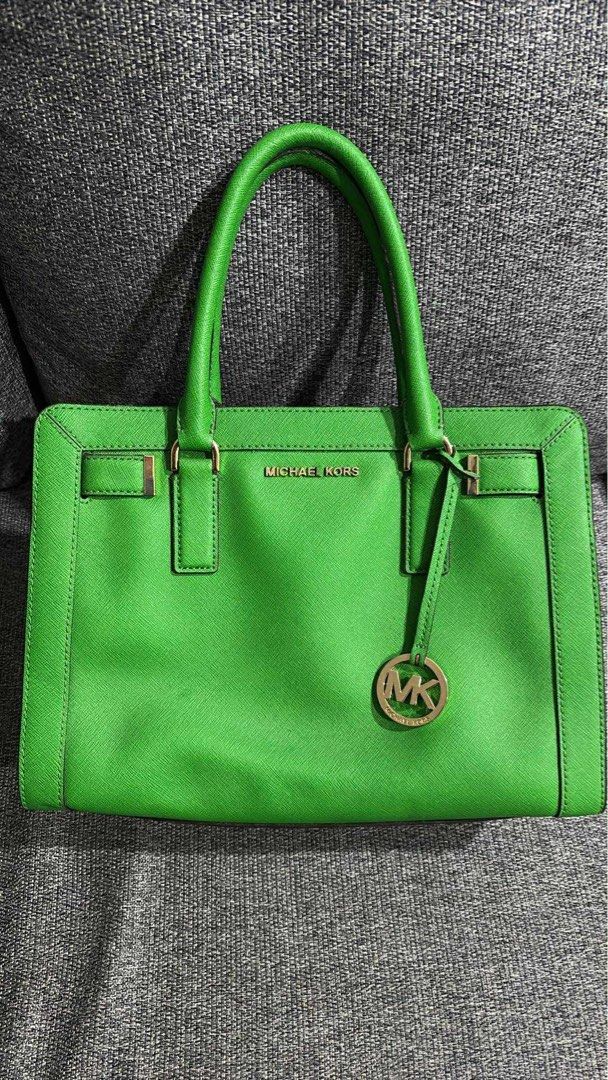 Michael Kors Green Satchel Handbag (Category: Luxury Bags & Wallets) located in Dasmarinas. Submitted by kddeclutterr (Listing ID 1422780214, Image 1). Description: - Authentic Michael Kors satchel handbag - Bright green color - Top handle and detachable shoulder strap - Includes care card - Michael Kors logo lining - Gold-tone hardware - Michael Kors logo charm - Protective metal feet -Price Negotiable .