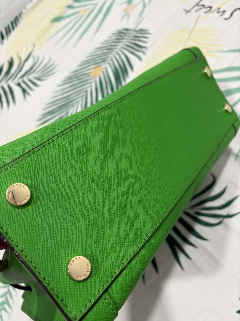 Michael Kors Green Satchel Handbag (Category: Luxury Bags & Wallets) located in Dasmarinas. Submitted by kddeclutterr (Listing ID 1422780214, Image 3). Description: - Authentic Michael Kors satchel handbag - Bright green color - Top handle and detachable shoulder strap - Includes care card - Michael Kors logo lining - Gold-tone hardware - Michael Kors logo charm - Protective metal feet -Price Negotiable .