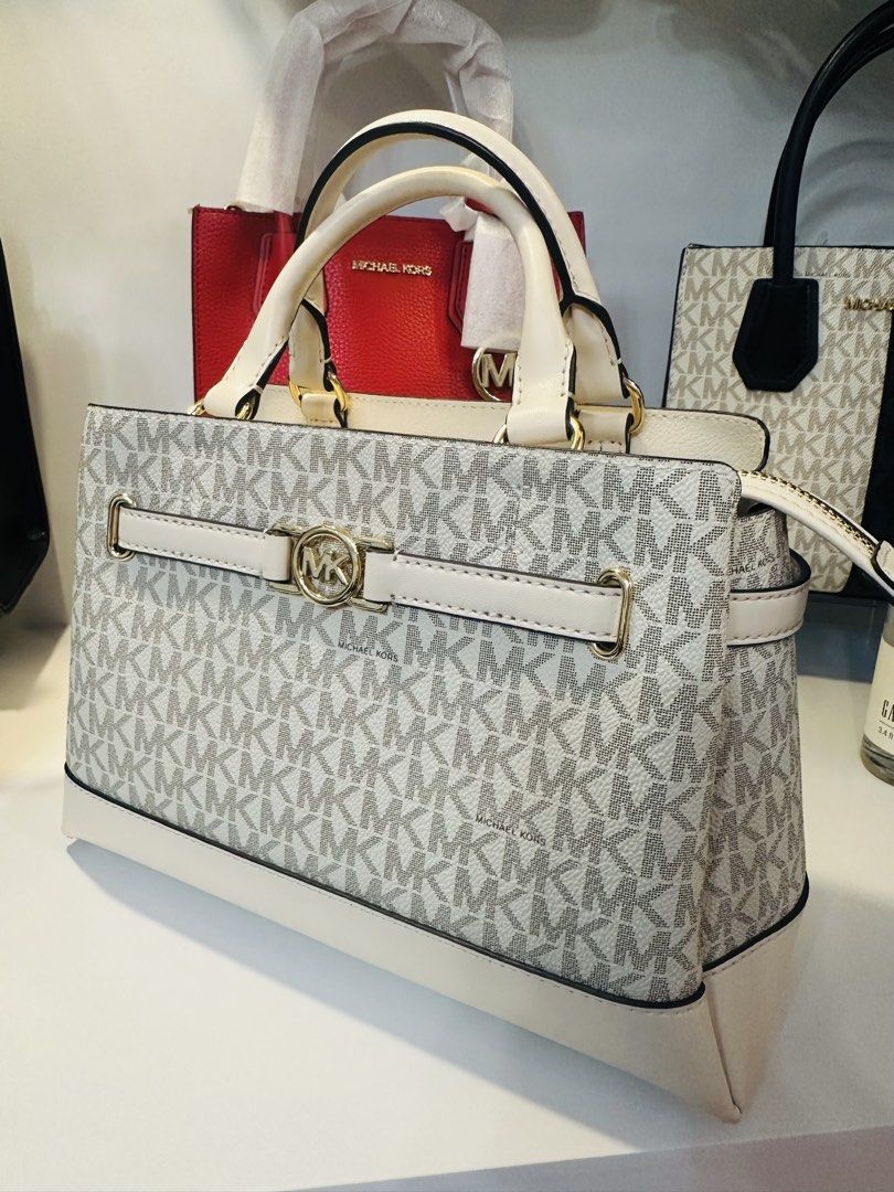 Michael Kors Reed Small Belted Satchel (Category: Luxury Bags & Wallets) located in Porac. Submitted by bagitupshopph (Listing ID 1422807862, Image 3). Description: 💯 Brand new and Authentic from 🇺🇸 Michael Kors Small Reed Belted Satchel in Light Cream color with MK logo pattern - Features: - Detachable strap - Zippered main compartment - Interior: Michael Kors label - Original price tag attached: $498.00 SALE!! From 5,799 down to 5,500.