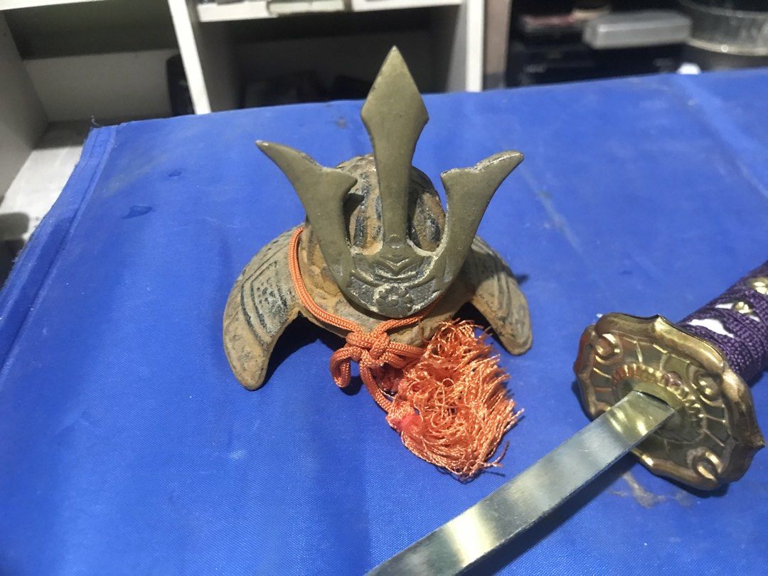 Miniature Samurai Sword with Helmet (Category: Vintage Collectibles) located in Santo Tomas. Submitted by retrotastic (Listing ID 1422734085, Image 3). Description: Mini gold toned katana and samurai headgear .