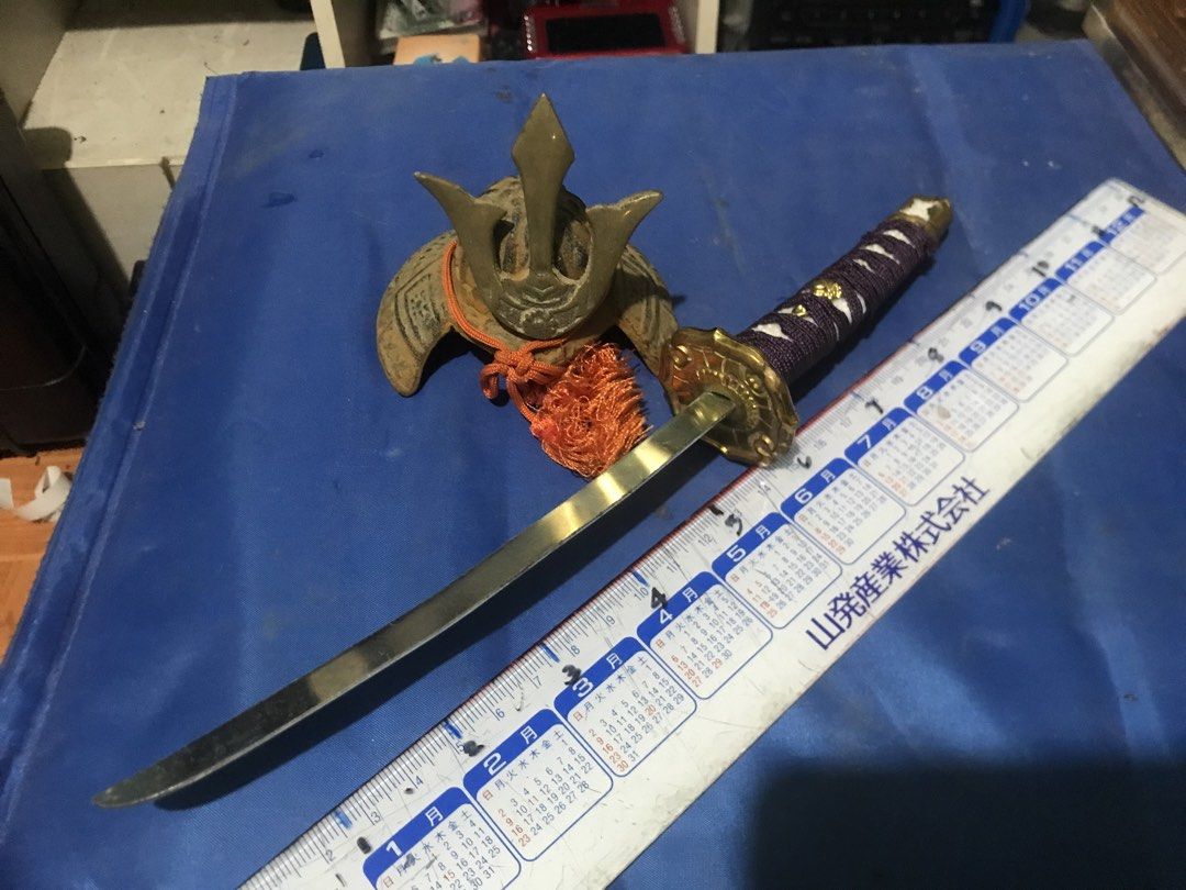 Miniature Samurai Sword with Helmet (Category: Vintage Collectibles) located in Santo Tomas. Submitted by retrotastic (Listing ID 1422734085, Image 1). Description: Mini gold toned katana and samurai headgear .