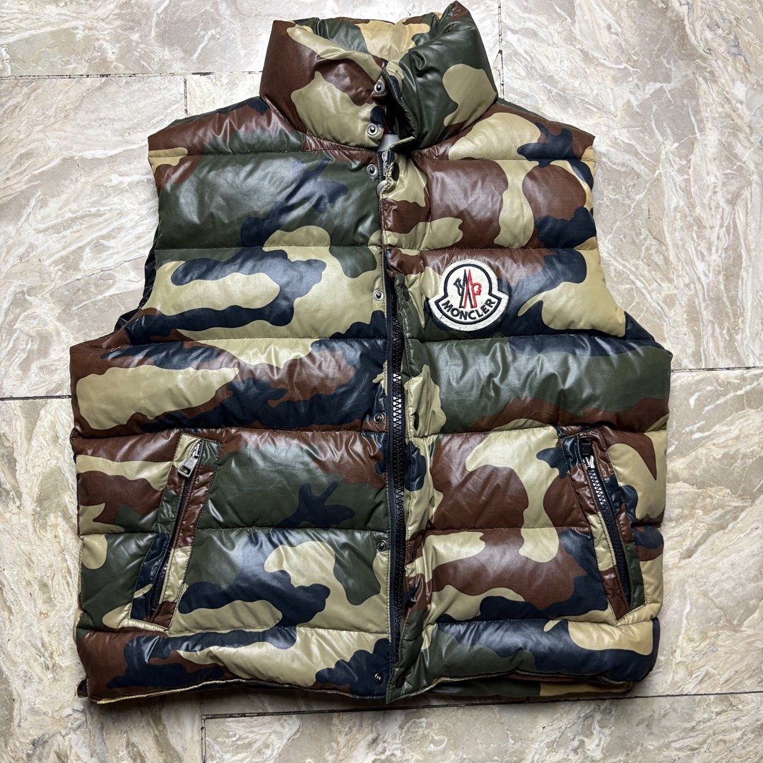 Moncler Camouflage Puffer Vest (Category: Luxury Apparel) located in Dinalupihan. Submitted by hell.thrift (Listing ID 1422864945, Image 1). Description: Size:1 Length:22 Width:22 No issue as new Puffiness 10/10 .