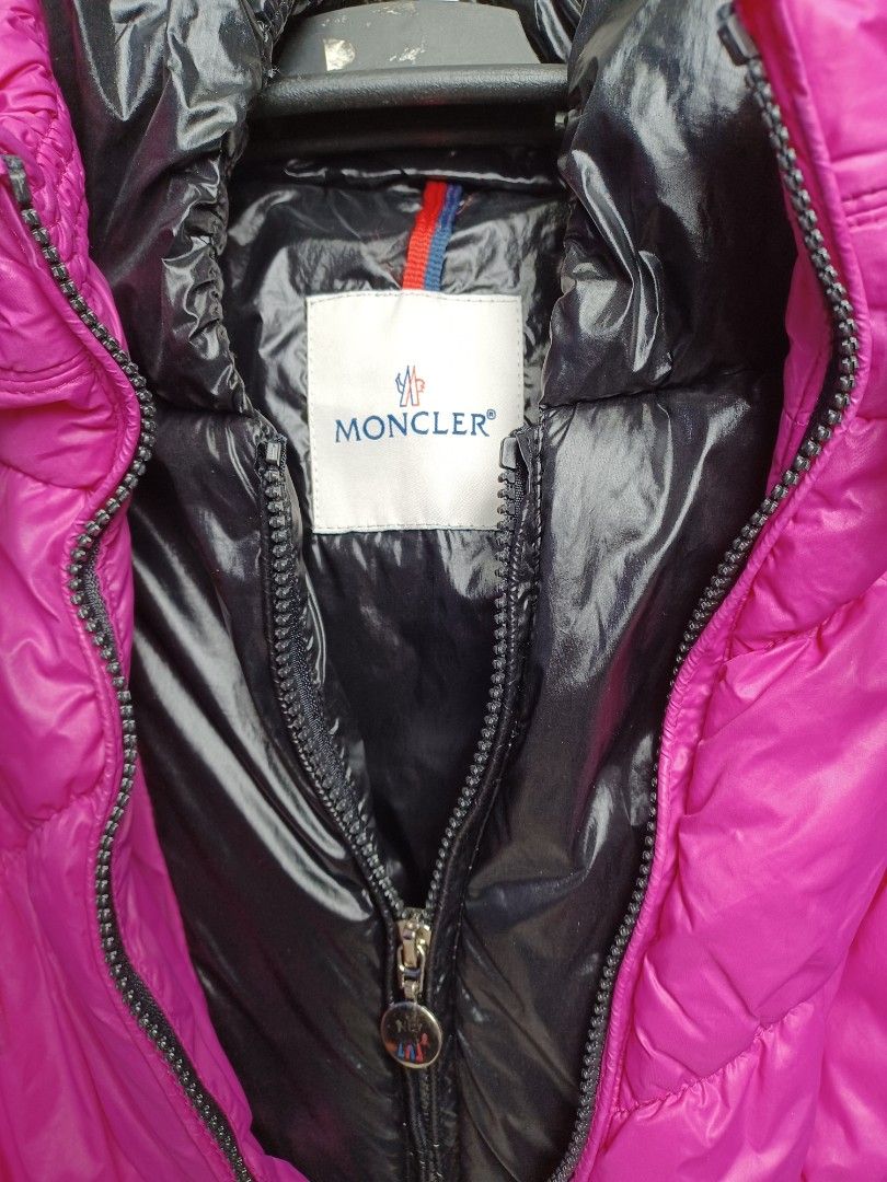Moncler Puffer Jacket size small baguio city (Category: Coats, Jackets and Outerwear) located in Baguio. Submitted by restyrille77846 (Listing ID 1422715647, Image 2). Description: - Authentic Moncler puffer jacket - Vibrant pink color - Glossy black interior and hood - Zipper closure - Moncler logo on zipper and details - Includes tag with Moncler logo - Filled with real down feathers.