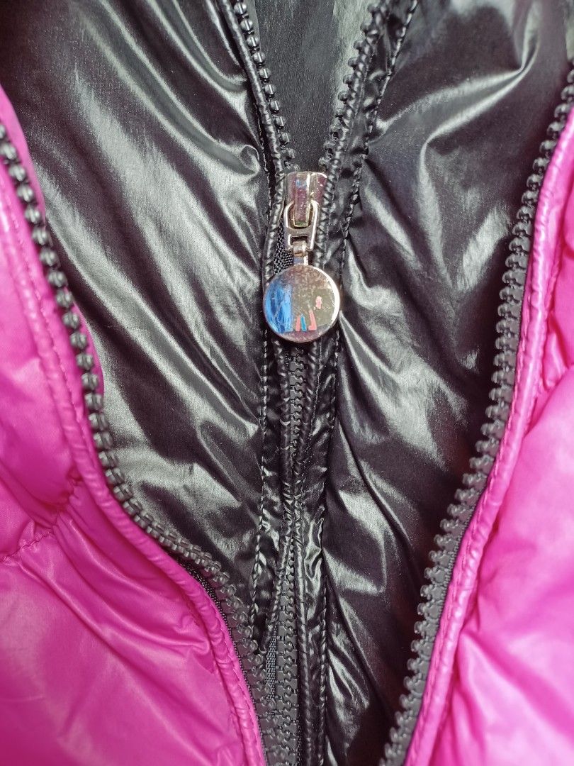 Moncler Puffer Jacket size small baguio city (Category: Coats, Jackets and Outerwear) located in Baguio. Submitted by restyrille77846 (Listing ID 1422715647, Image 3). Description: - Authentic Moncler puffer jacket - Vibrant pink color - Glossy black interior and hood - Zipper closure - Moncler logo on zipper and details - Includes tag with Moncler logo - Filled with real down feathers.