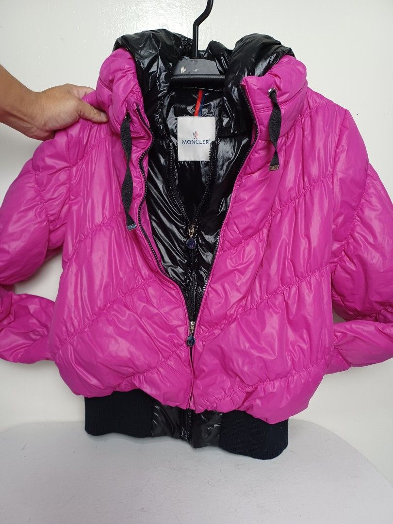 Moncler Puffer Jacket size small baguio city (Category: Coats, Jackets and Outerwear) located in Baguio. Submitted by restyrille77846 (Listing ID 1422715647, Image 1). Description: - Authentic Moncler puffer jacket - Vibrant pink color - Glossy black interior and hood - Zipper closure - Moncler logo on zipper and details - Includes tag with Moncler logo - Filled with real down feathers.
