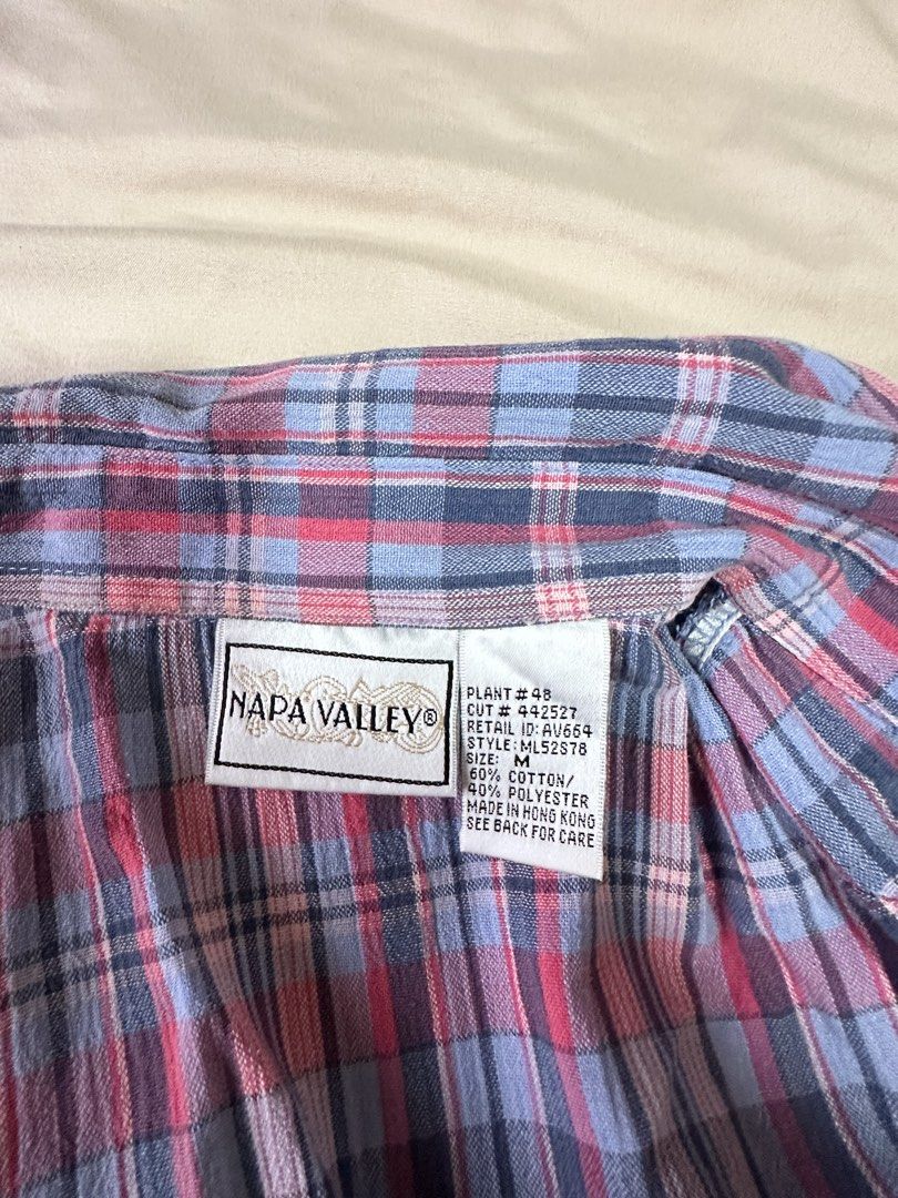 Napa Valley Plaid Shirt - Size M (Category: Tshirts & Polo Shirts ) located in Tabuk. Submitted by classicseconds (Listing ID 1422765488, Image 3). Description: - Napa Valley plaid shirt - Size: M - Unique quilted design - Short sleeves - Collared neckline - Material: Cotton/Polyester blend - Button-down closure - Relaxed fit - Perfect for casual wear.
