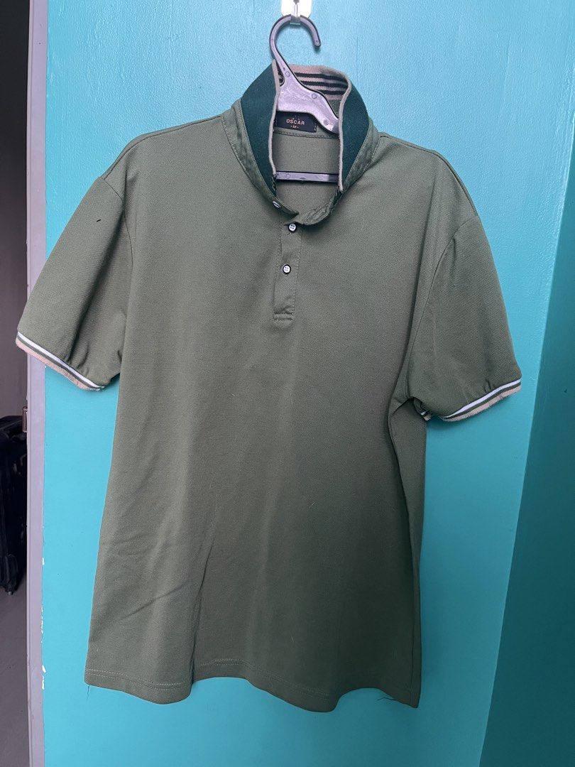 Oscar Polo Shirt - Olive Green (Category: Tshirts & Polo Shirts ) located in Pasay City. Submitted by godiii (Listing ID 1422797499, Image 2). Description: - Oscar polo shirt - Color: Olive green - Size: M - Contrasting collar with striped detailing - Contrasting trim on short sleeves - Button-up placket - Brand label visible.