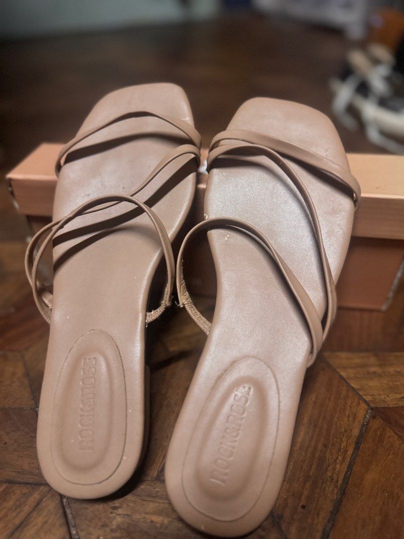 Rock & Rose Strappy Sandals (Category: Flats & Sandals) located in Las Pinas. Submitted by declutterverse (Listing ID 1422873103, Image 3). Description: - Rock & Rose strappy sandals - Neutral beige color - Square toe design - Comes with original box - Soles show some wear - Ideal for everyday or casual wear.
