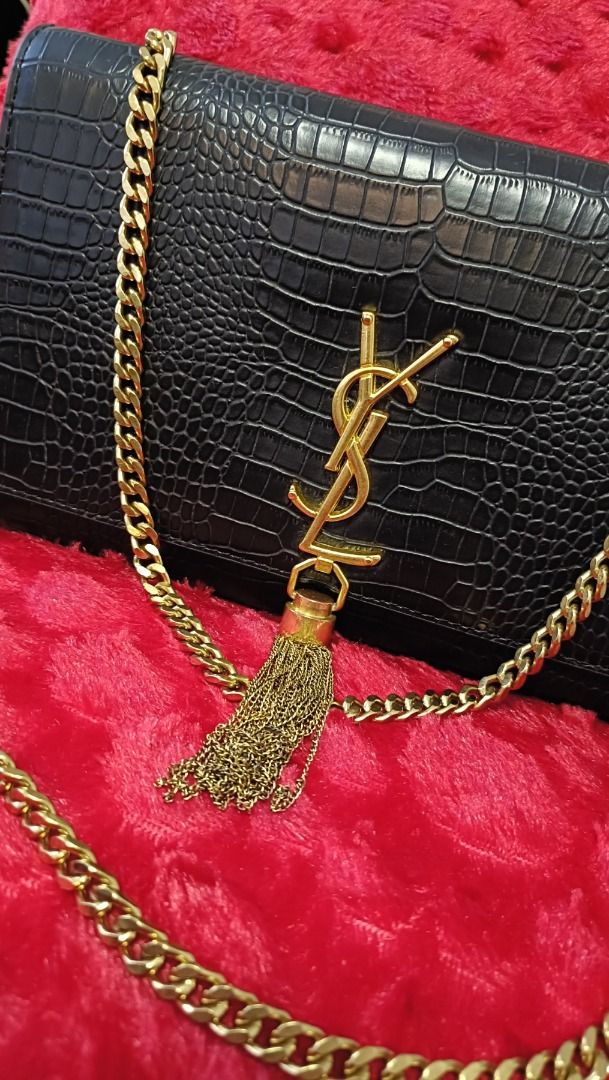 Saint Laurent Black Crocodile-Embossed Chain Bag (Category: Luxury Bags & Wallets) located in Cebu City. Submitted by erlacoleccion (Listing ID 1422762482, Image 3). Description: - Saint Laurent Chain Bag - Black, crocodile-embossed finish - Gold-tone YSL logo - Made in Italy - Dimensions: Approx. 28cm (L) x 18cm (H) - Features: Zippered interior pocket, magnetic snap closure.