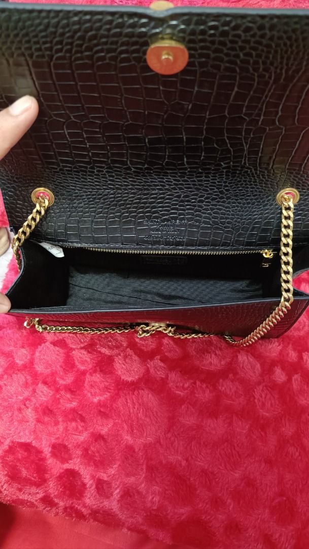 Saint Laurent Black Crocodile-Embossed Chain Bag (Category: Luxury Bags & Wallets) located in Cebu City. Submitted by erlacoleccion (Listing ID 1422762482, Image 1). Description: - Saint Laurent Chain Bag - Black, crocodile-embossed finish - Gold-tone YSL logo - Made in Italy - Dimensions: Approx. 28cm (L) x 18cm (H) - Features: Zippered interior pocket, magnetic snap closure.